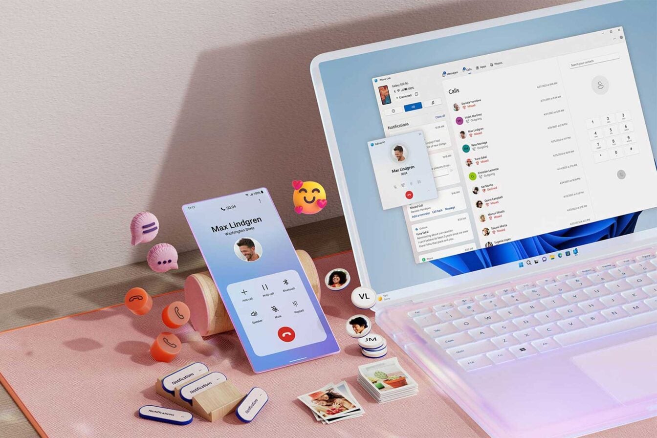 Msft Open Laptop With Mobile Phone Floating Emojis