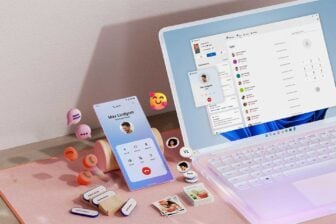 Msft Open Laptop With Mobile Phone Floating Emojis